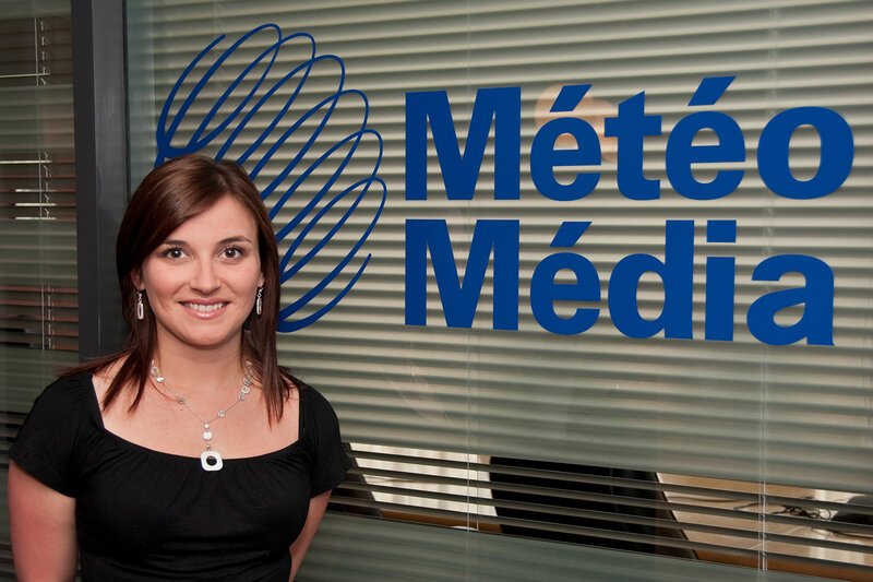 Woman in front of Meteo Media sign