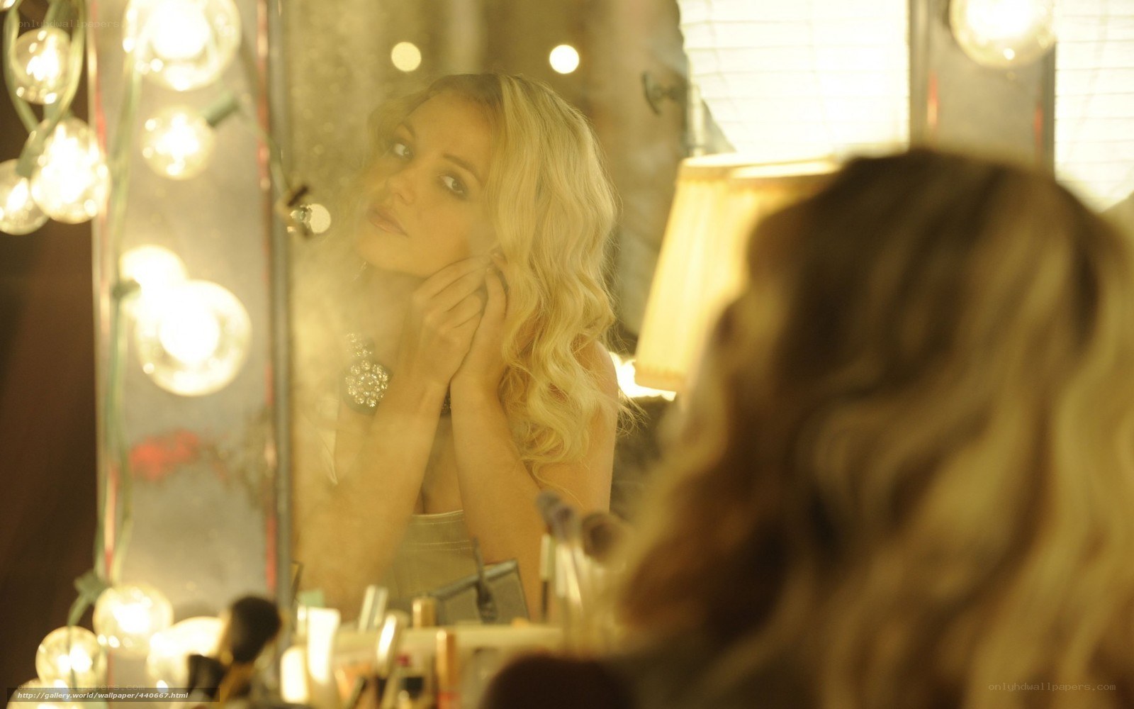 woman in front of mirror
