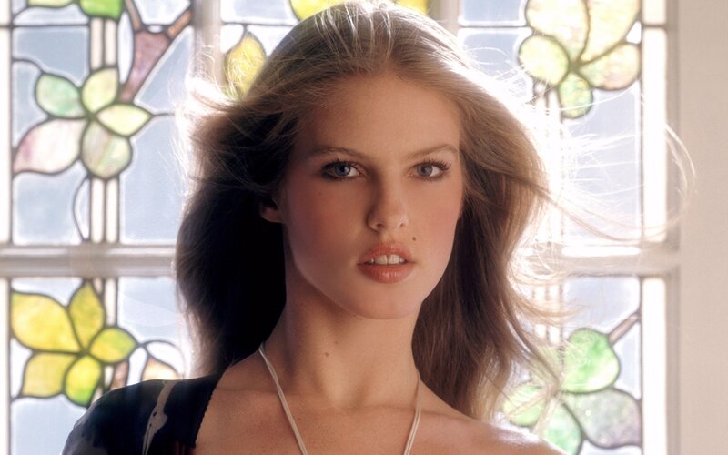woman in front of stained glass