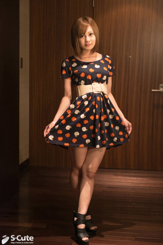 Woman in fruit-patterned dress
