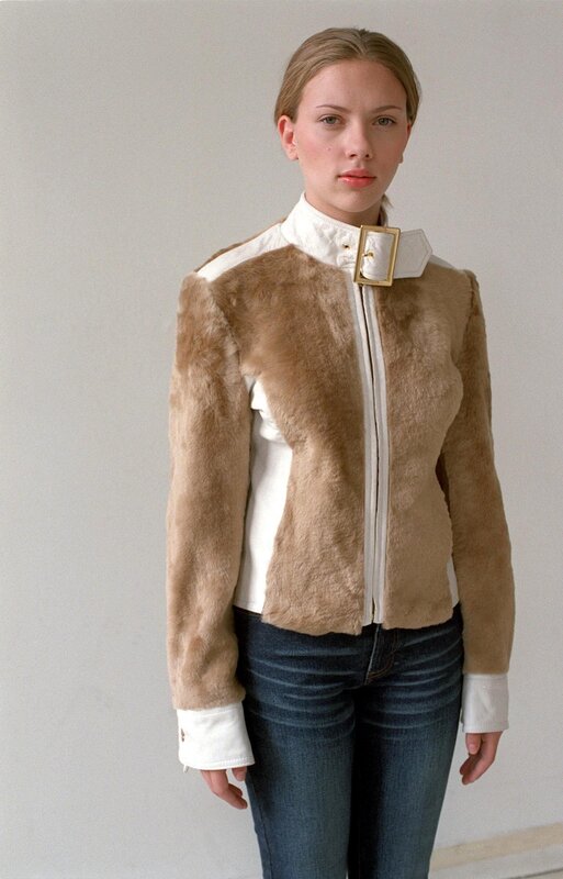 woman in fur and leather jacket