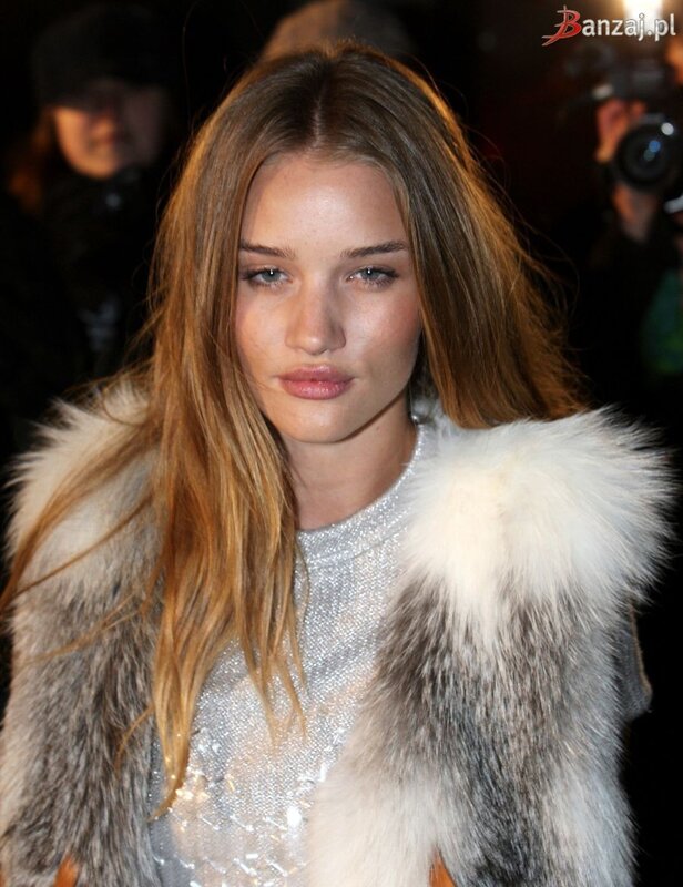 woman in fur coat at event