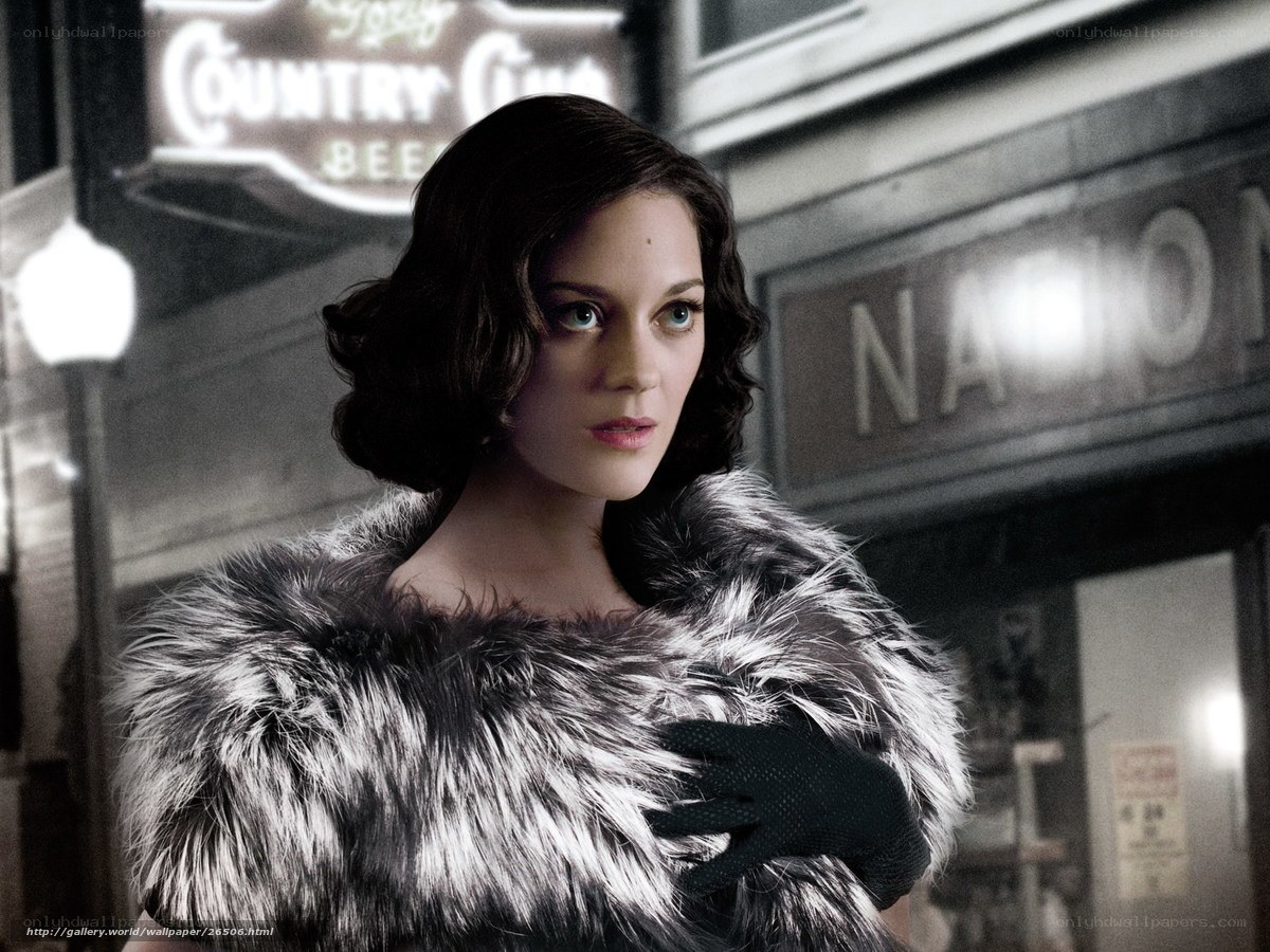 Woman in fur coat at night