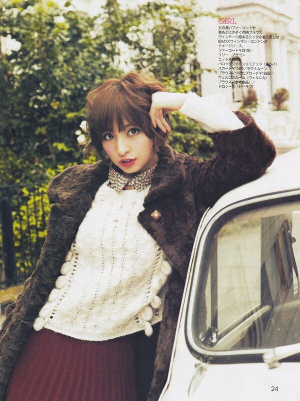 woman in fur coat by car