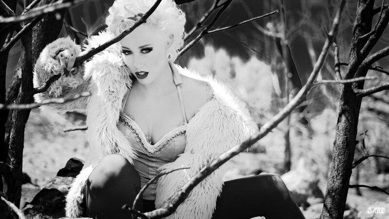 woman in fur coat in forest