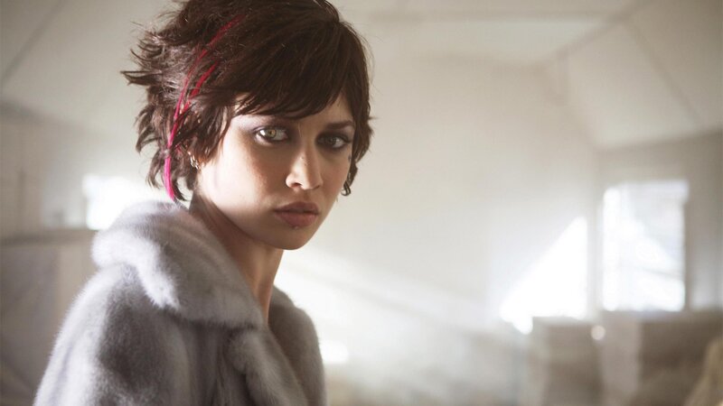 woman in fur coat looking at camera
