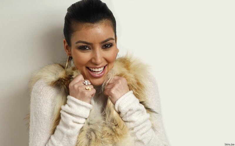 woman in fur coat smiling