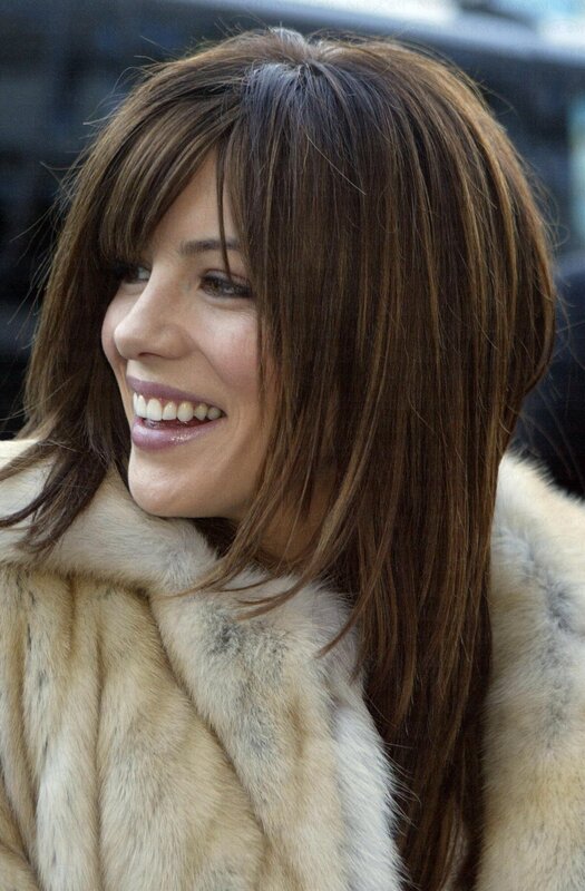woman in fur coat smiling