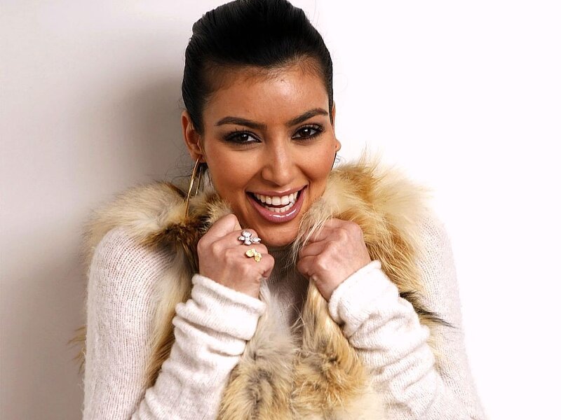 woman in fur coat smiling