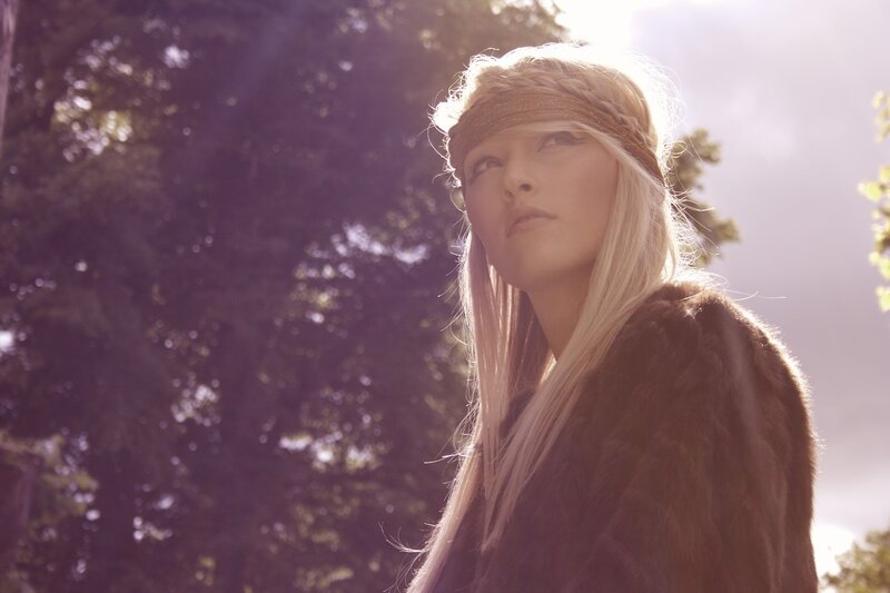woman in fur coat with headband