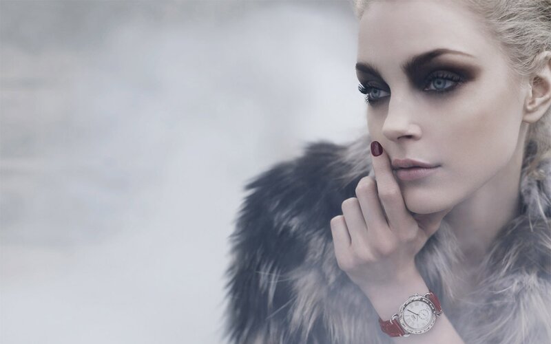 woman in fur coat with watch