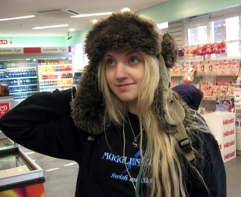 Woman in fur hat at convenience store