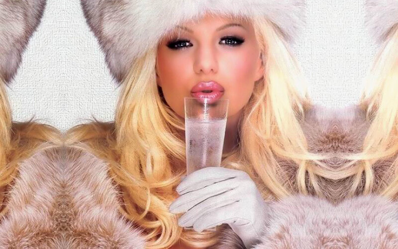woman in fur hat drinking