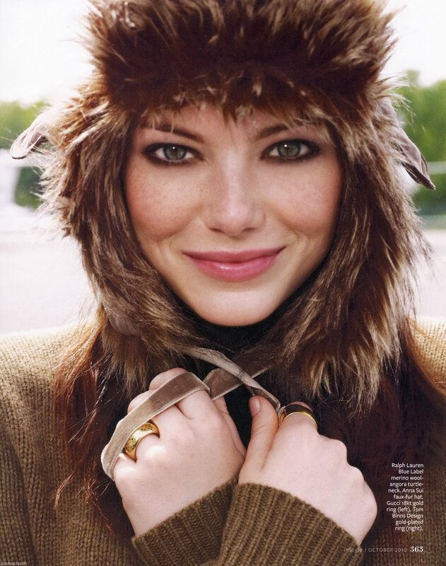 woman in fur hat smiling