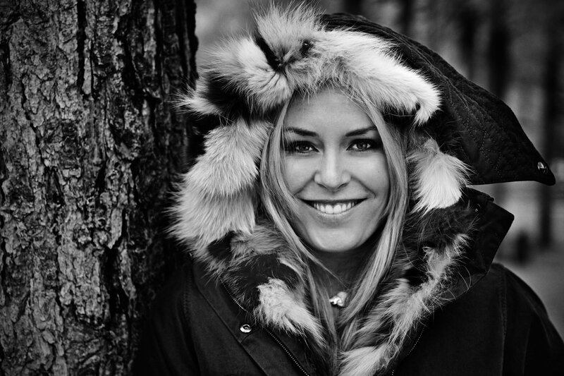 woman in fur hat smiling