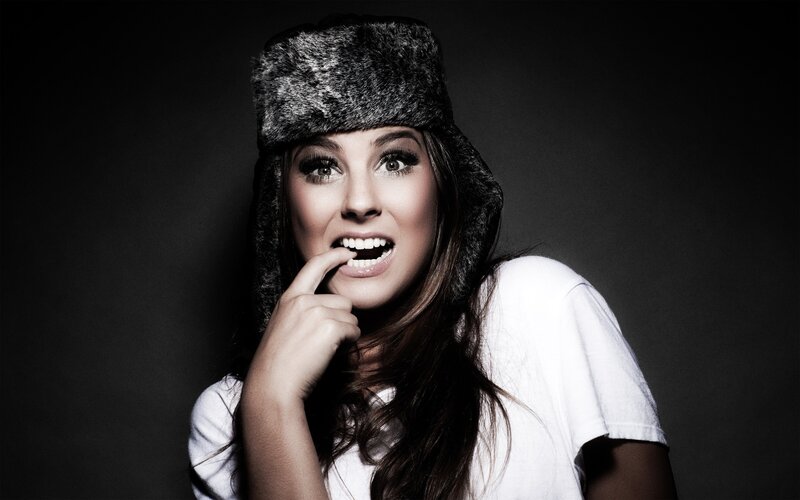 woman in fur hat smiling