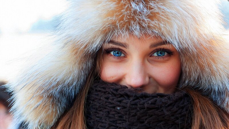 woman in fur hat smiling