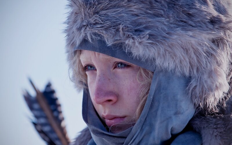 woman in fur hat with arrow