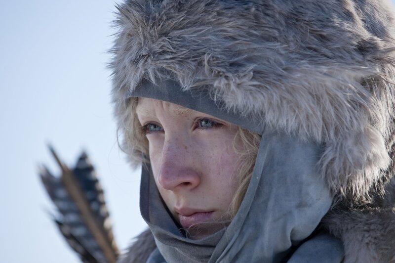 woman in fur hat with arrow