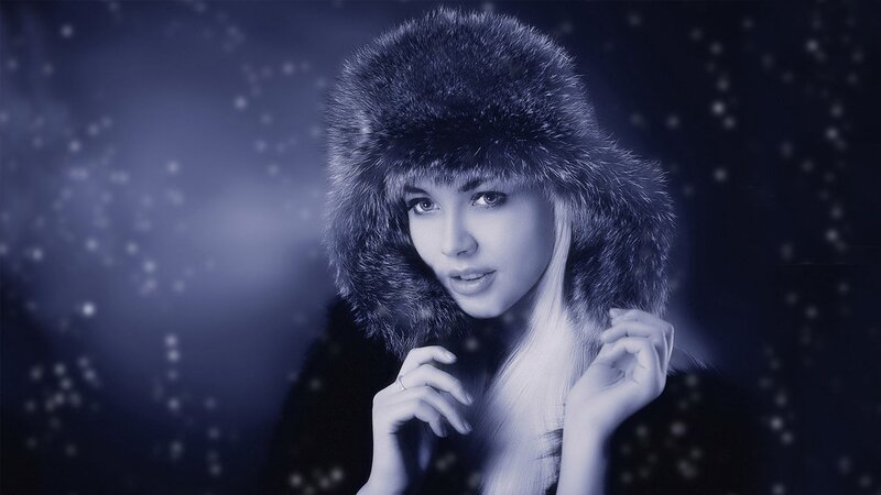 woman in fur hat with snow
