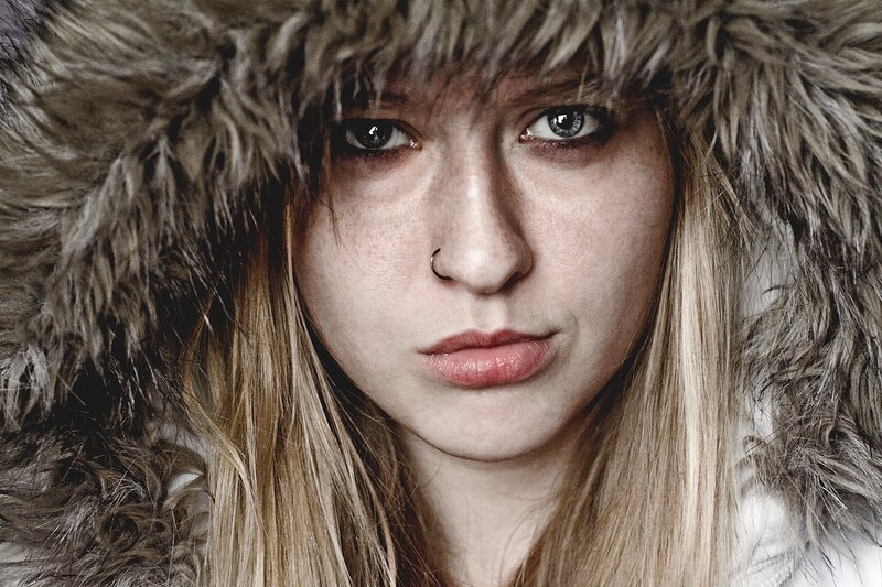 Woman in Fur Hood — Brown, Serious, Winter
