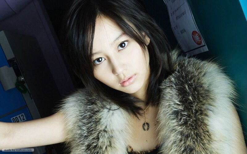 woman in fur vest looking at camera