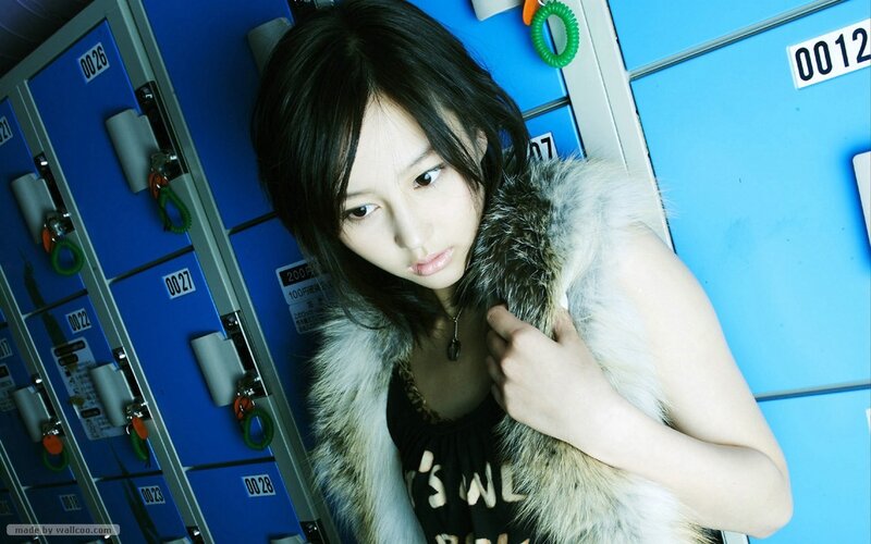 woman in fur vest near lockers
