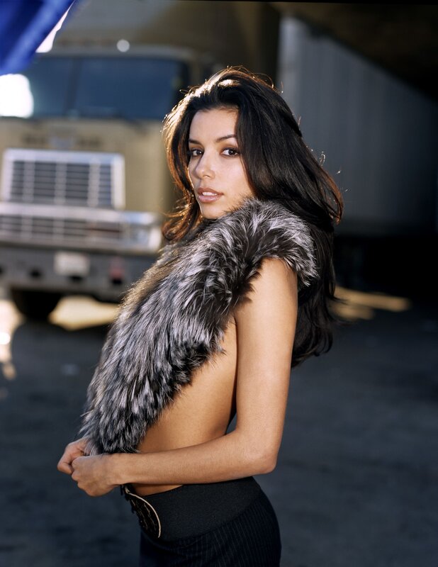 woman in fur vest posing