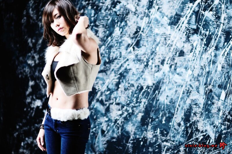 woman in fur vest posing