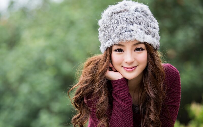 woman in furry hat outdoors