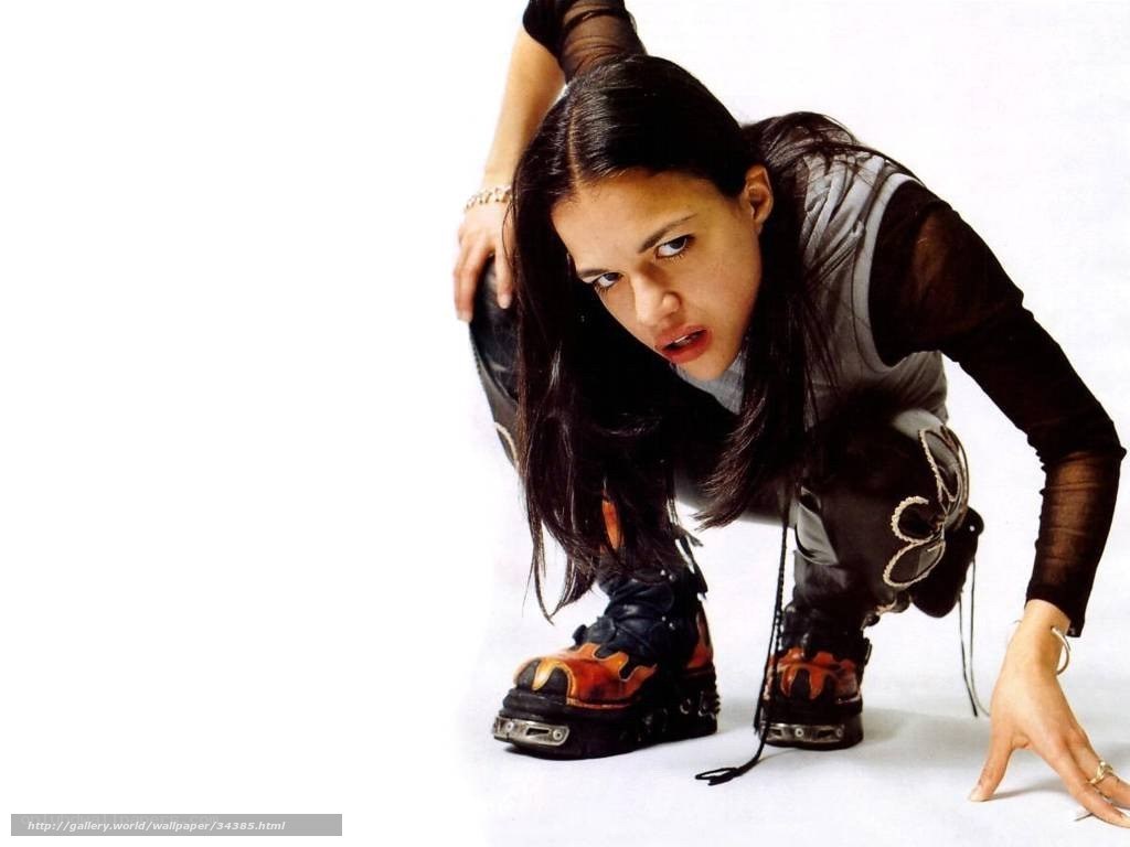 woman in futuristic boots crouching