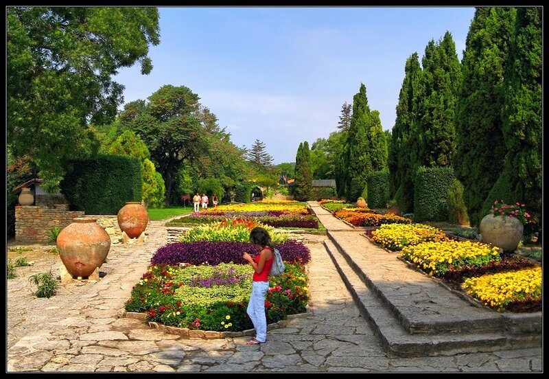 Woman in Garden — Green, Serene, Afternoon, Photograph, Flowers, Pots