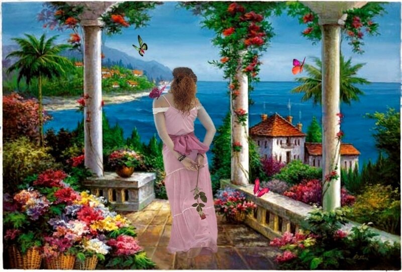 Woman in garden overlooking sea
