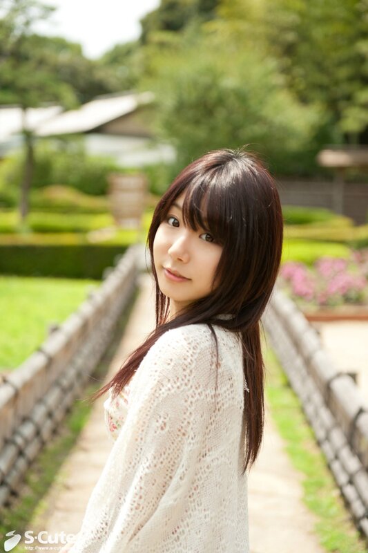 Woman in garden wearing sweater