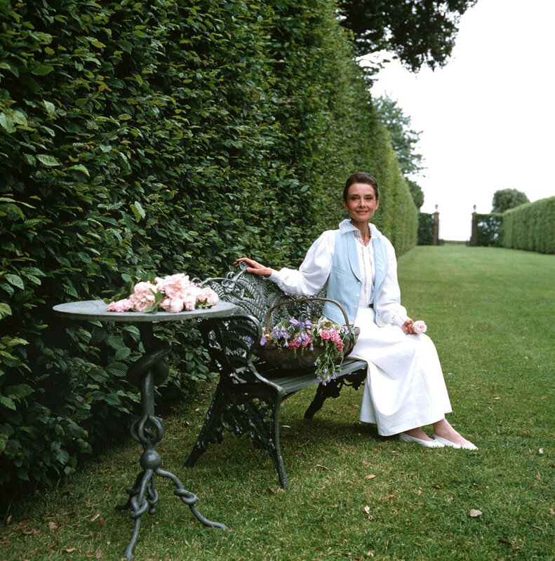 Woman in garden with flowers