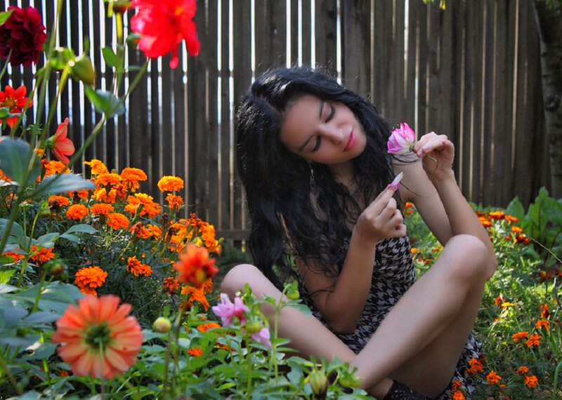 Woman in Garden with Flowers — Red