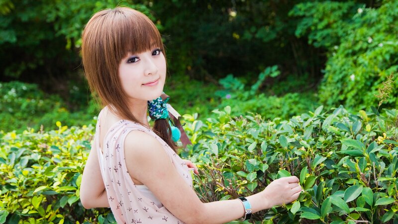 woman in garden with greenery