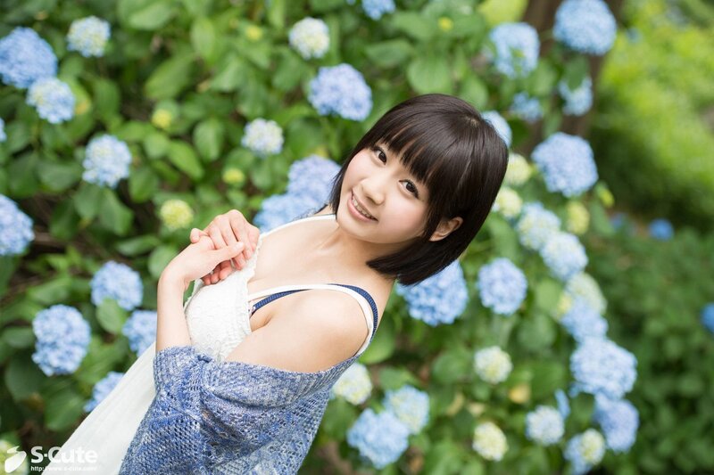 Woman in garden with hydrangeas