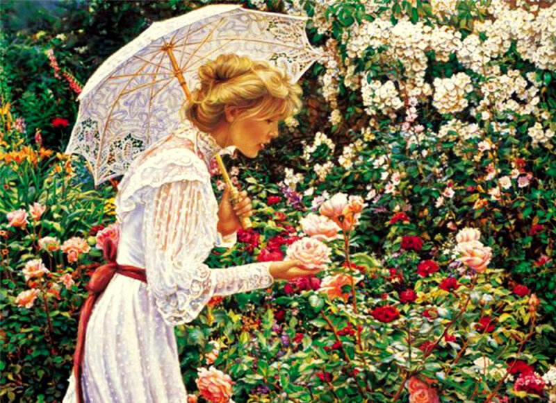 Woman in garden with parasol
