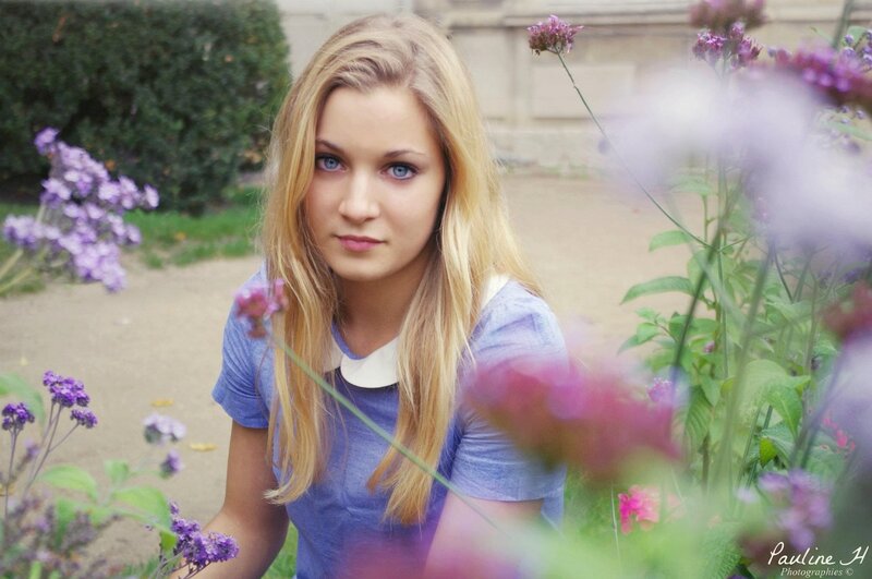 woman in garden with purple flowers