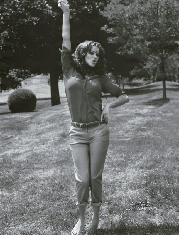 woman in garden with raised arm