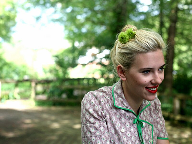 woman in garden with red lipstick