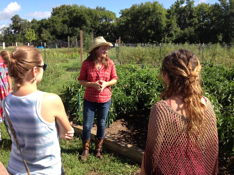 Woman in Garden with Students