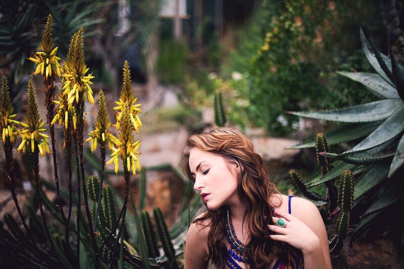 woman in garden with succulents