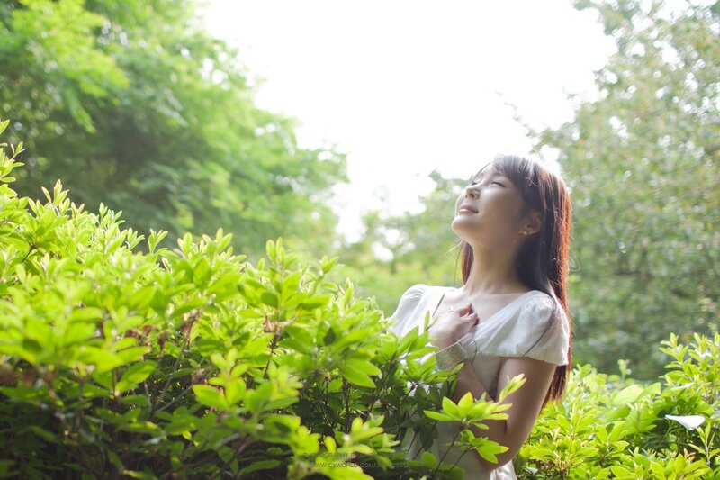 woman in garden with sunlight