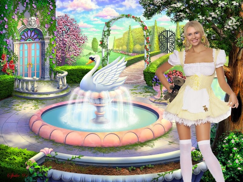 woman in garden with swan fountain