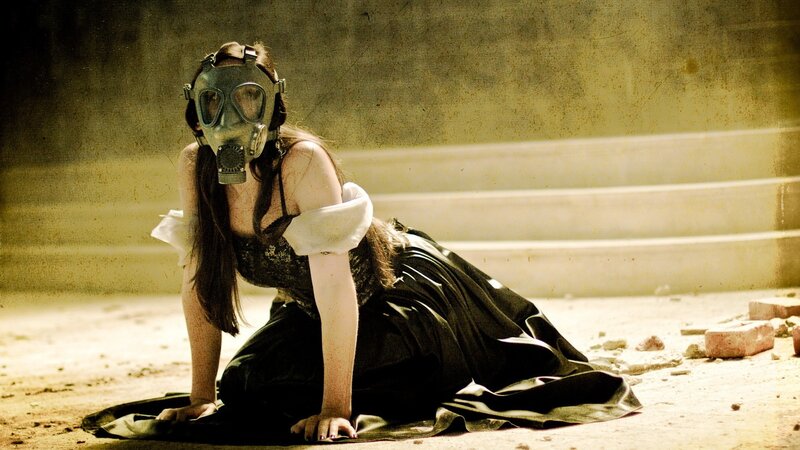 woman in gas mask on ground