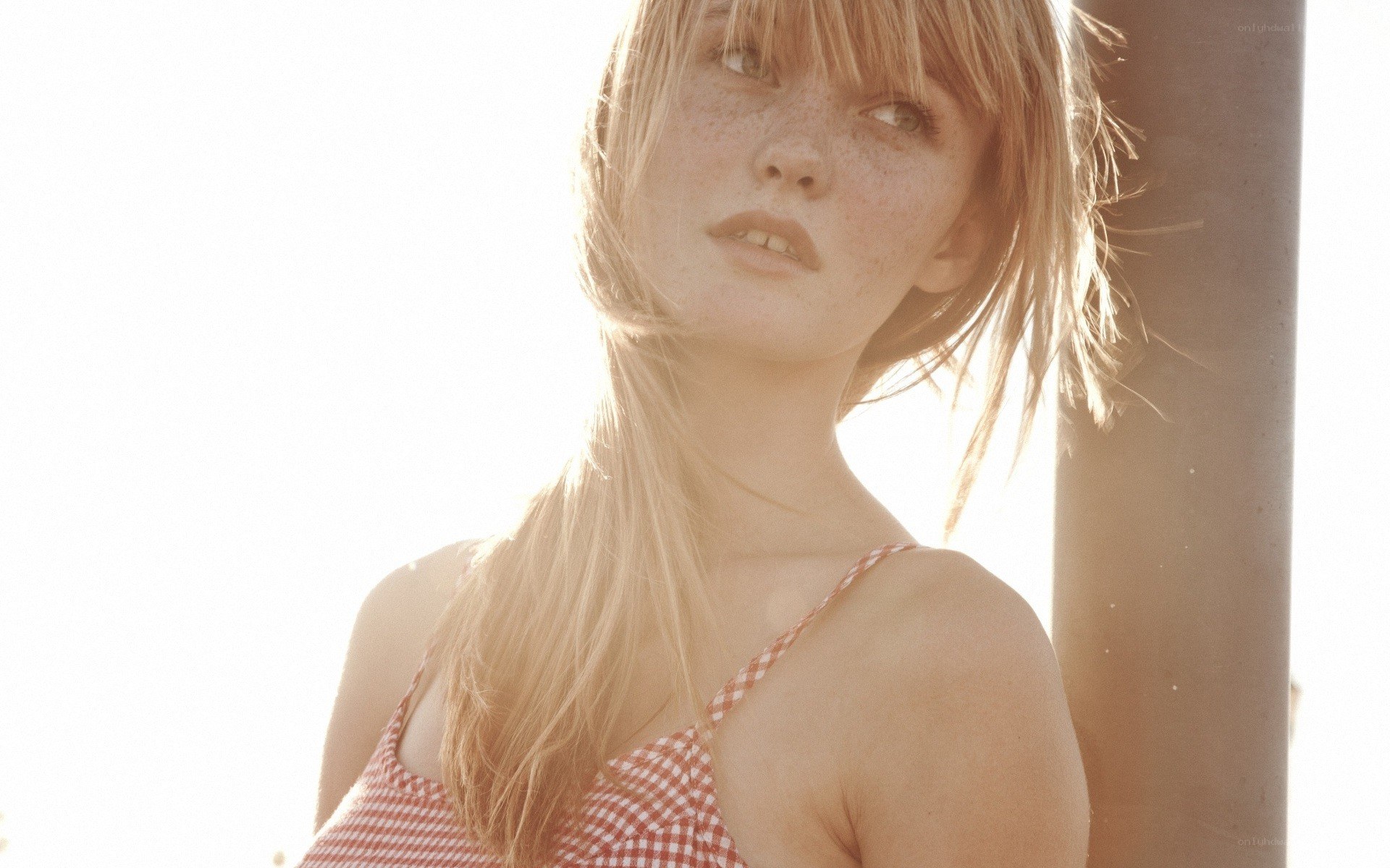 woman in gingham top
