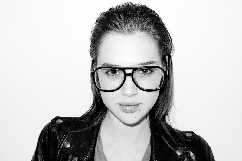 woman in glasses and leather jacket