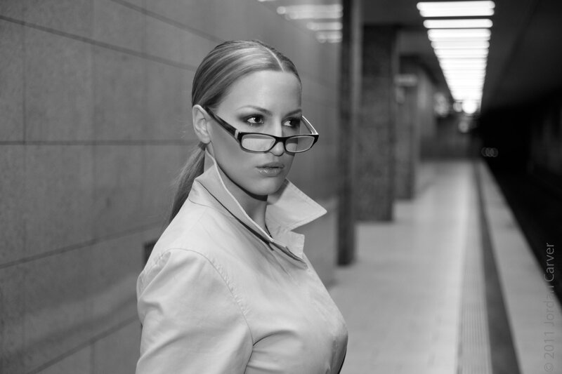 woman in glasses at subway station